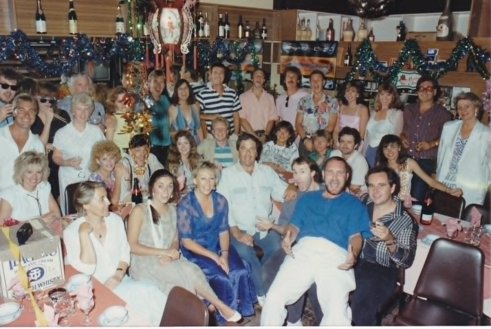 The Wonder World team at a Christmas party, among tinsel and champagne