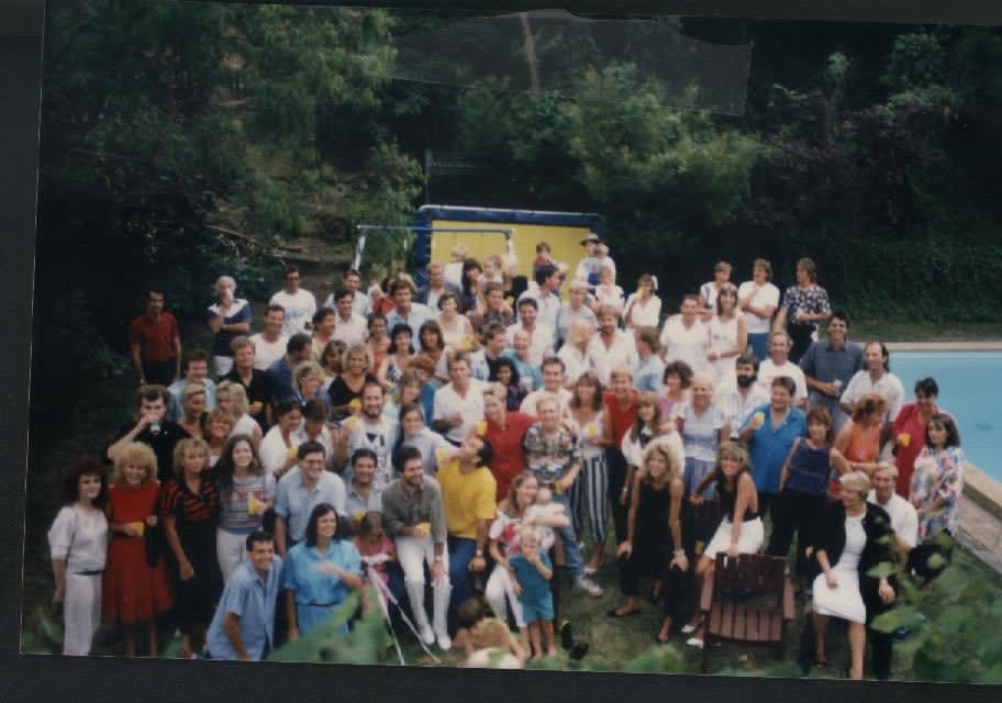 The Wonder World cast and crew, around eighty people, gathered by a swimming pool at the show's final party